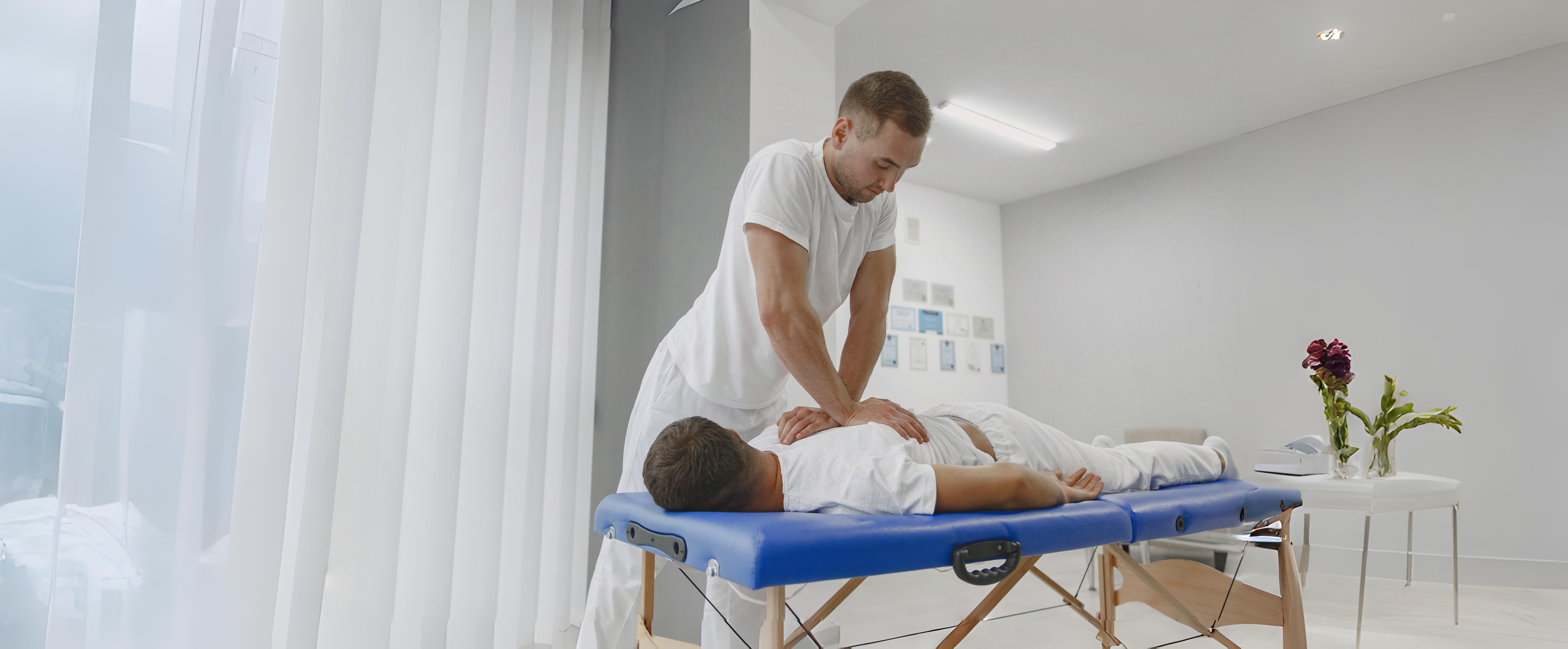 man-medical-office-physiotherapist-is-rehabilitating-back_1__1__Copy