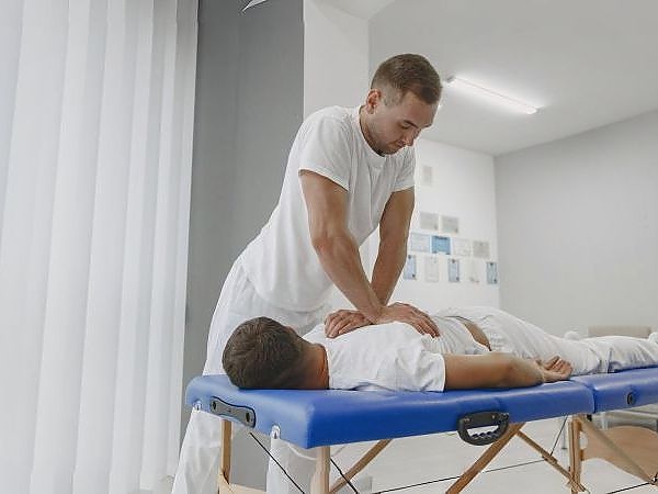 man-medical-office-physiotherapist-is-rehabilitating-back_1__1__Copy