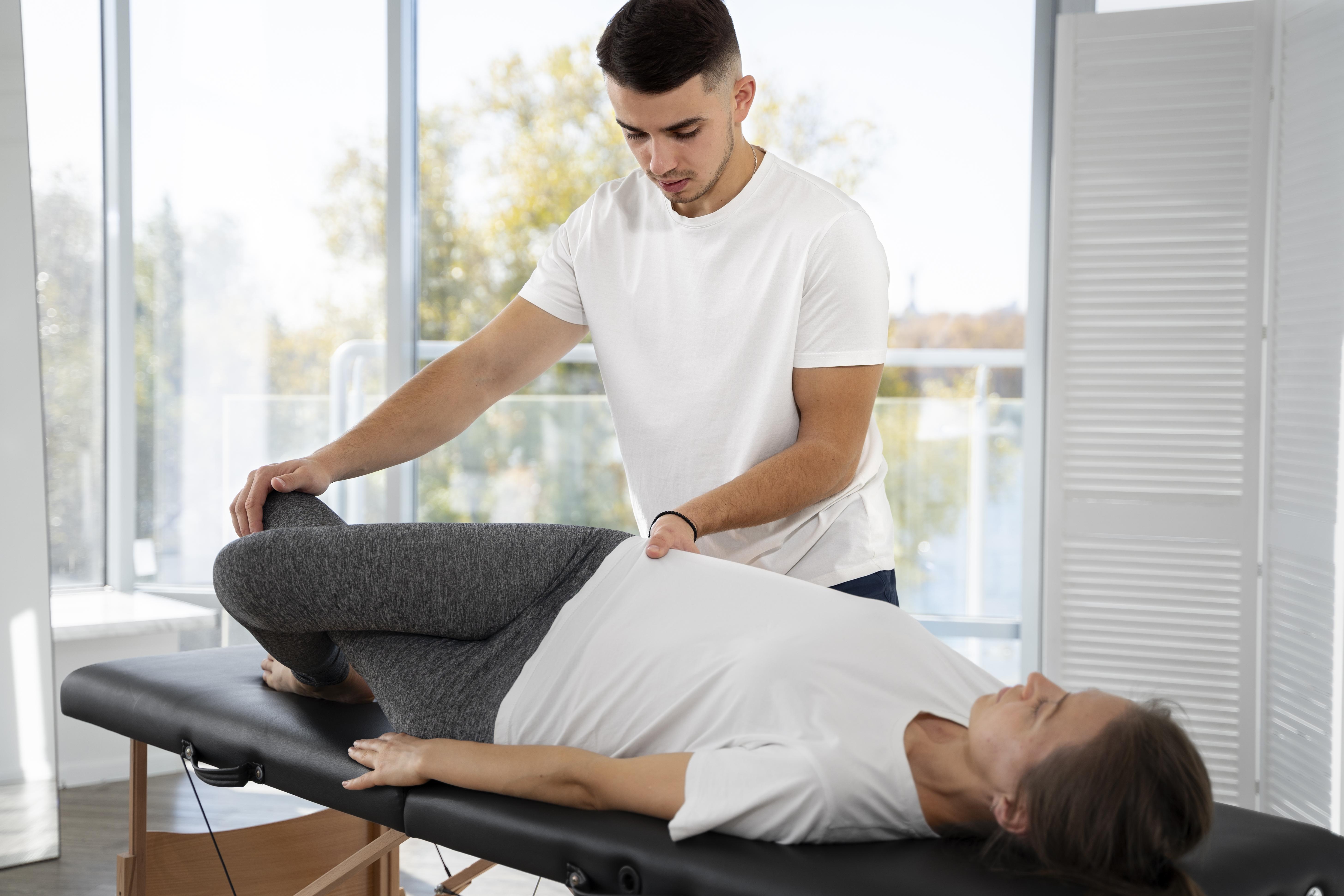 medium-shot-physiotherapist-helping-woman_Copy